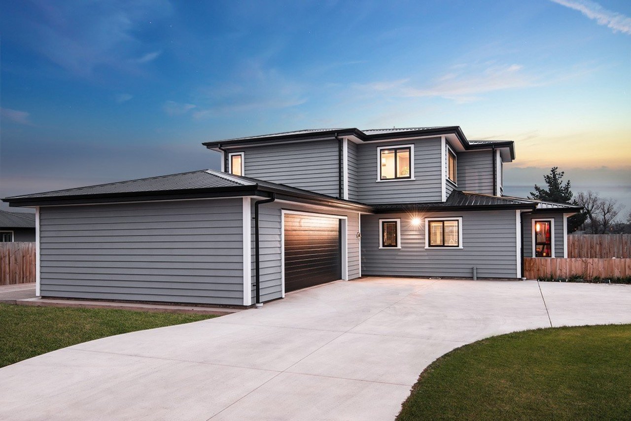 A new home clad with Envira Weatherboard System building, elevation, estate, facade, home, house, property, real estate, residential area, siding, sky, white