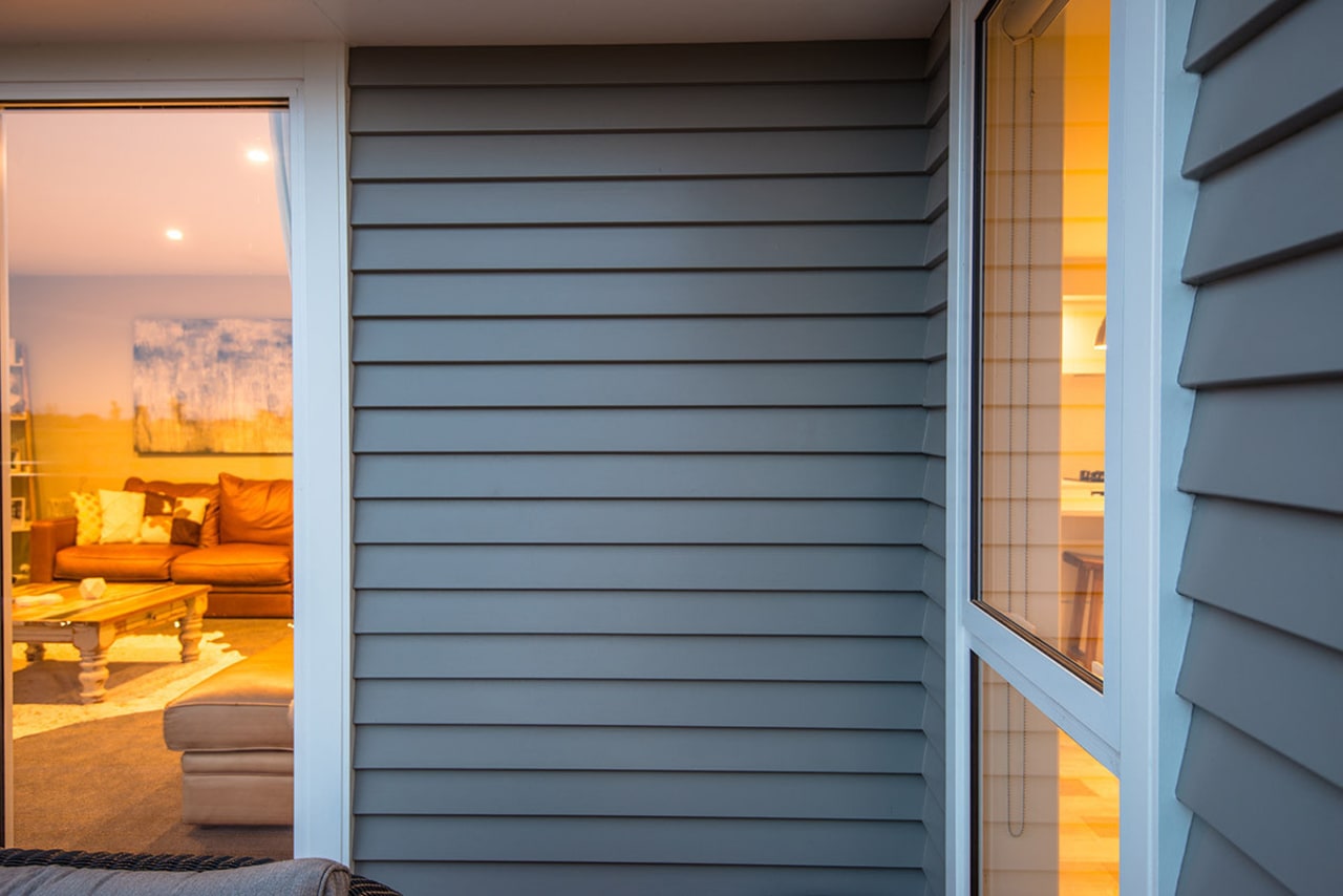 Detail of Niagara bevel back weatherboards and scribers door, facade, home, house, interior design, real estate, shade, siding, window, window blind, window covering, window treatment, wood, yellow, gray