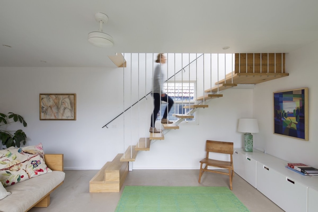 A floating stairway rises up to the second architecture, ceiling, daylighting, floor, furniture, handrail, home, house, interior design, living room, loft, real estate, room, stairs, wall, wood, gray