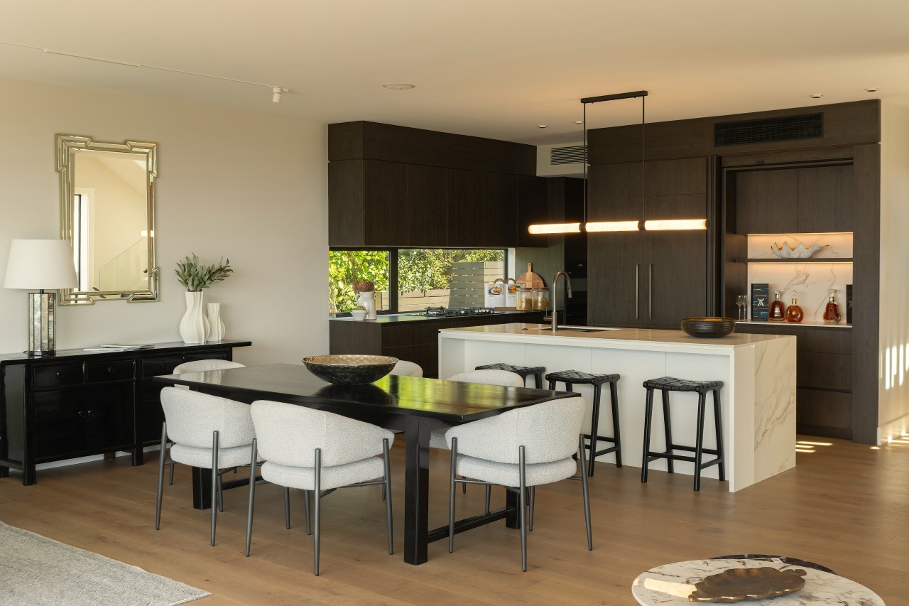 The kitchen connects seamlessly to the lounge, fireplace 