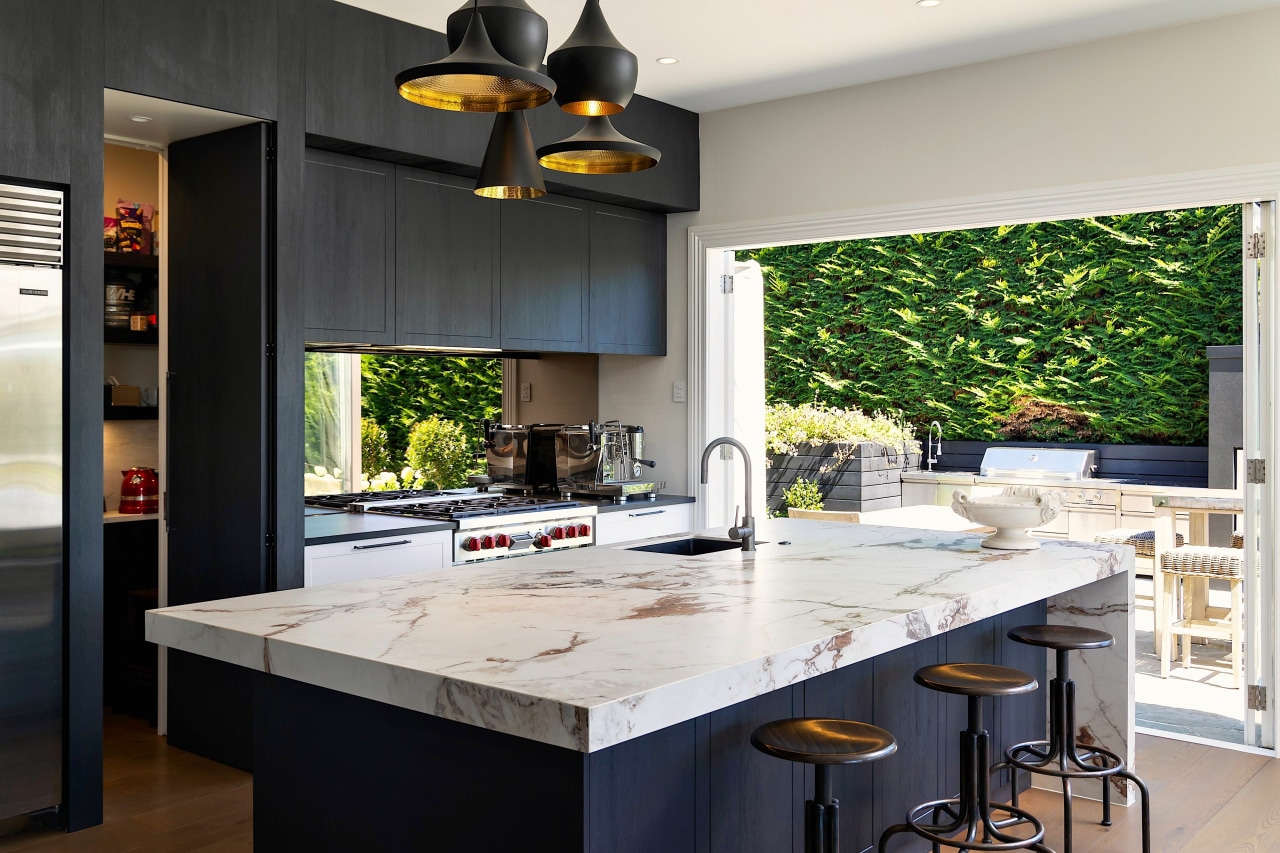 The waterfall-end Florim benchtop has the chunky, veined 