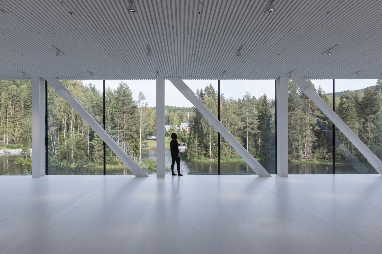 On the north end, a full-height glass wall architecture, building, ceiling, daylighting, floor, glass, house, interior design, line, pavilion, reflection, tourist attraction, tree, window, gray