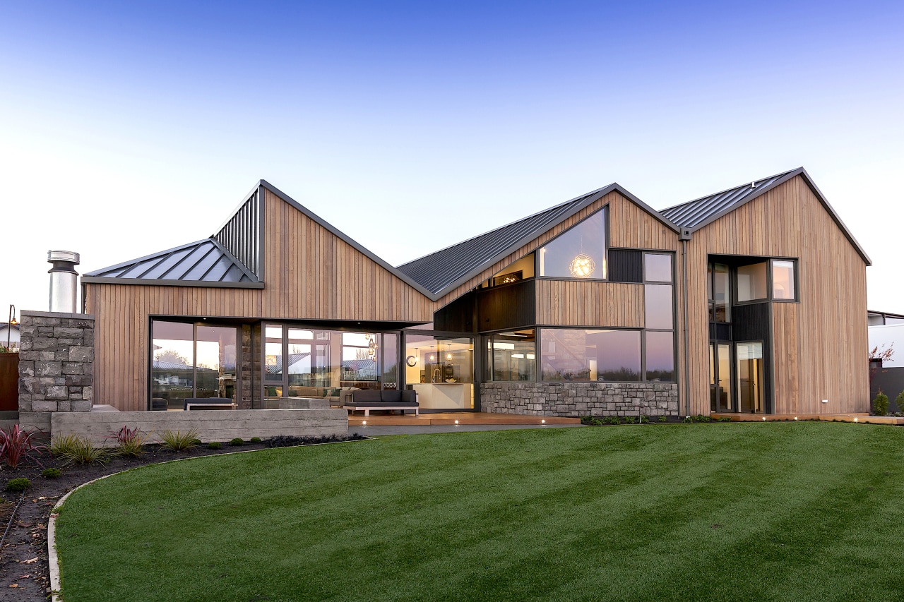 The home's architectural form includes three strong gable 