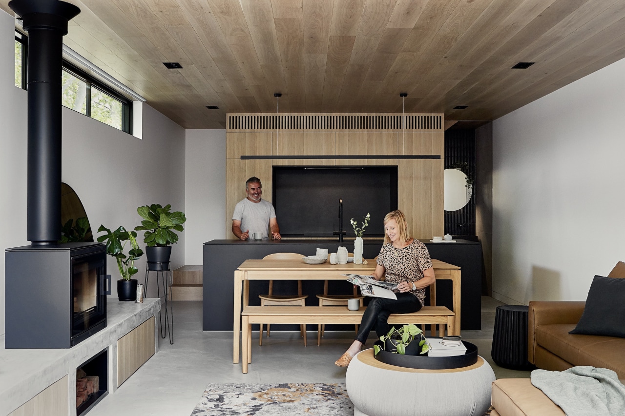 A wooden table, wooden bench seating and a