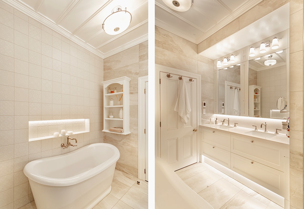 The spacious bathroom has a glamorous, classic-look presence. 