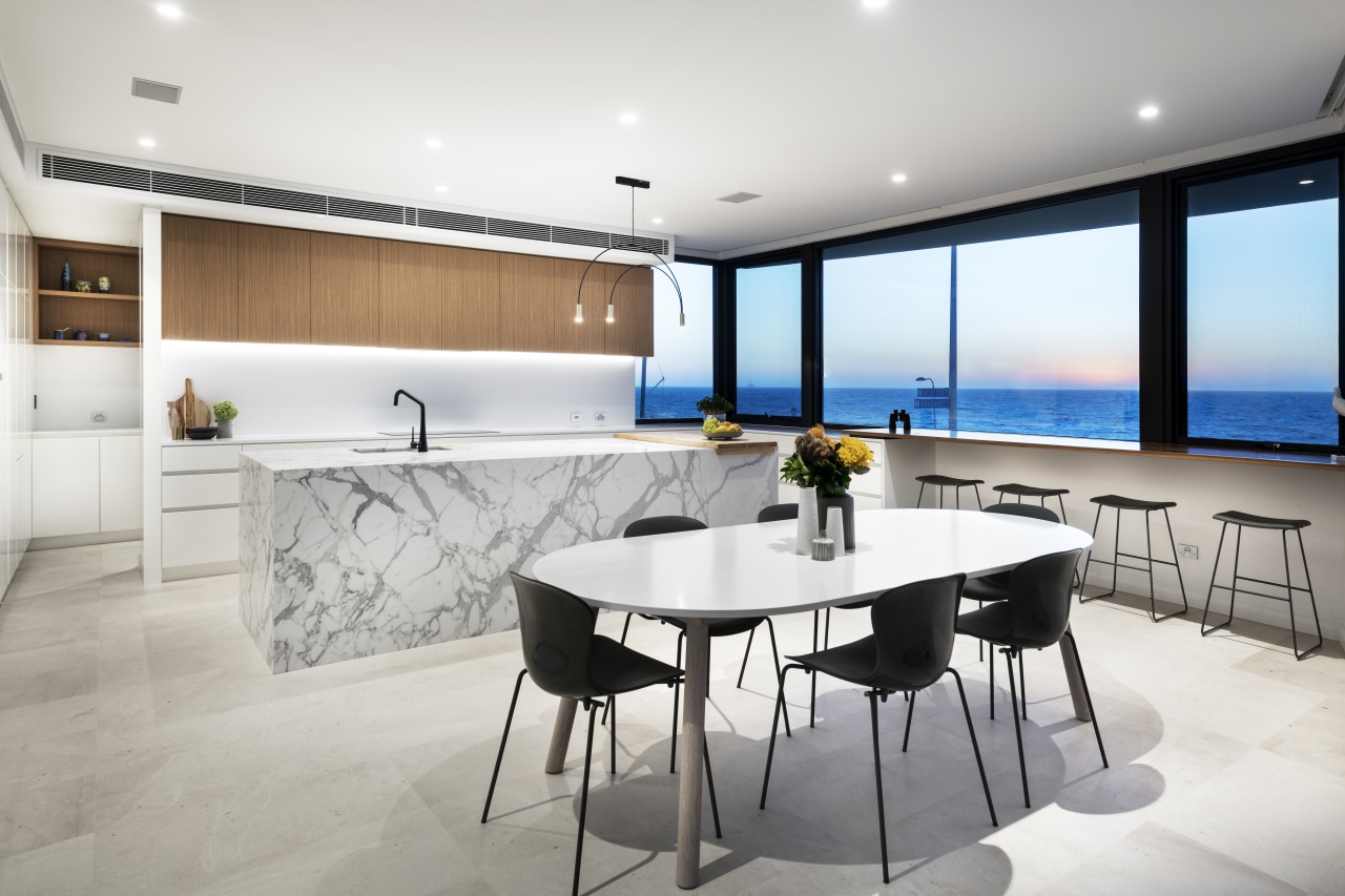 This kitchen offers both a focal point and architecture, building, cabinetry, ceiling, chair, countertop, design, dining room, floor, flooring, furniture, home, house, interior design, kitchen, living room, property, real estate, room, table, wall, white