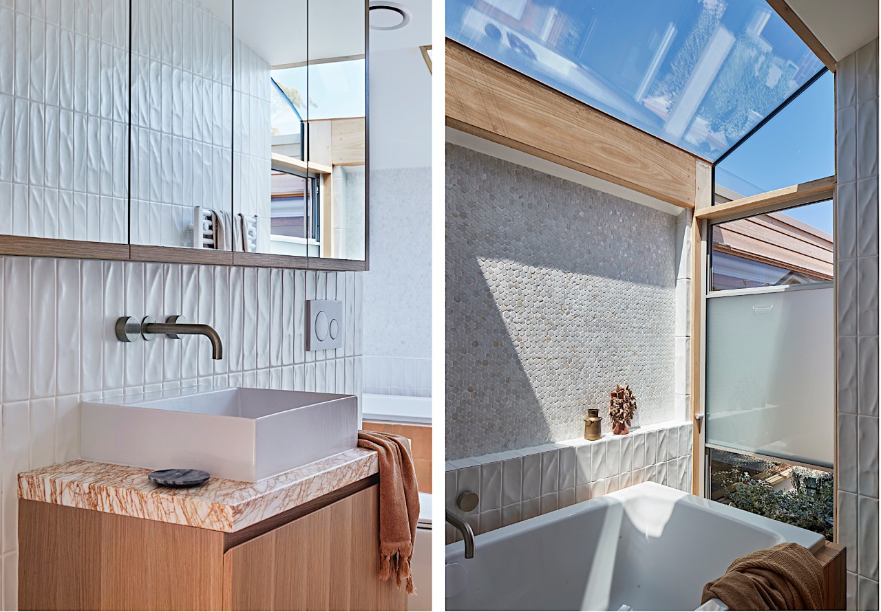 The warm, texture-rich bathroom is flooded with natural 