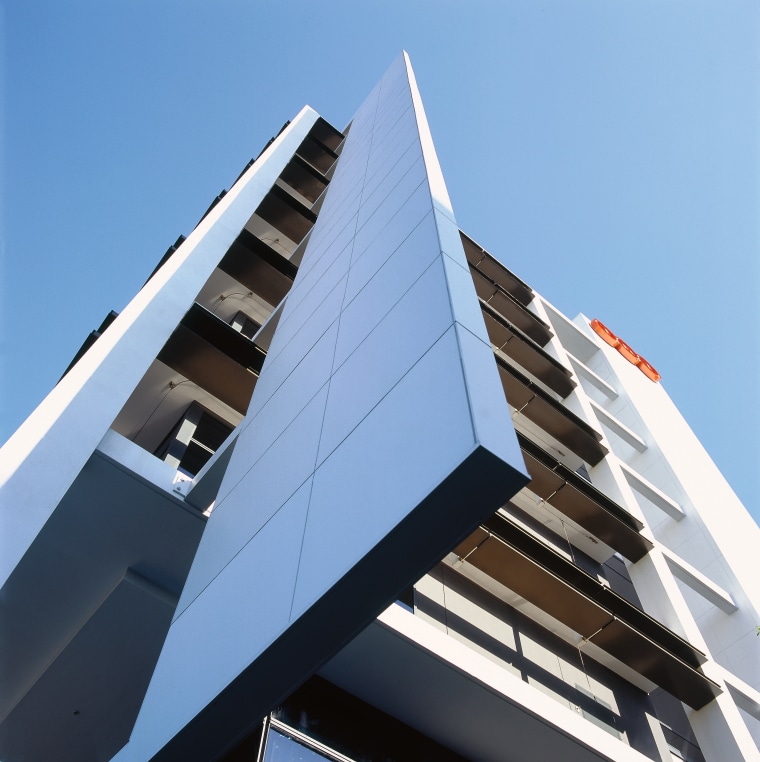 Exterior view of the TNT Australia building from angle, architecture, building, commercial building, condominium, corporate headquarters, daylighting, daytime, facade, line, sky, structure, teal, black