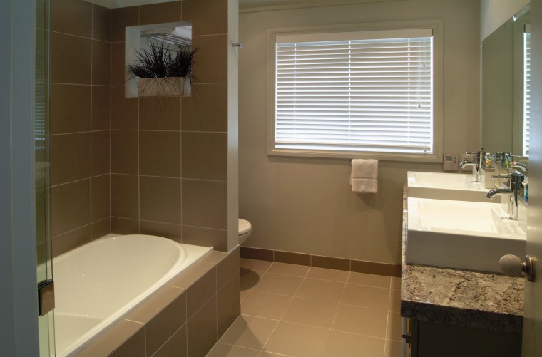 A view of a bathroom, brown tiled floor bathroom, floor, home, interior design, property, room, sink, tile, window, brown