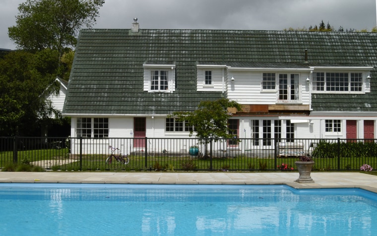 A view of the house before its roof cottage, estate, facade, home, house, property, real estate, residential area, swimming pool, villa, water, gray