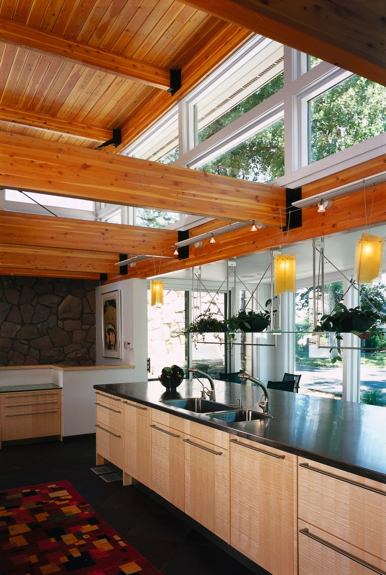 view of the stainless steel countertop and light architecture, ceiling, countertop, daylighting, house, interior design, kitchen, real estate, window, wood, brown