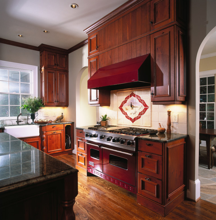 A view of a kitchen, wooden flooring and cabinetry, countertop, cuisine classique, hardwood, interior design, kitchen, room, red