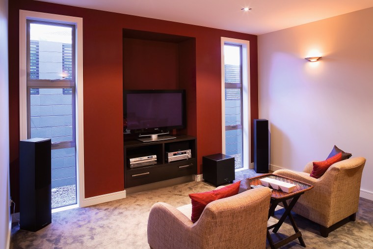 View of home theatre room with armchairs and home, interior design, living room, real estate, room, suite, red