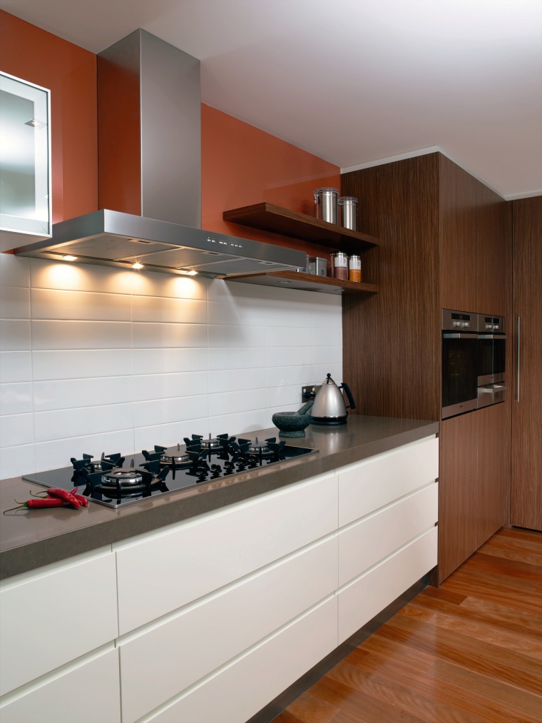 View of this kitchen Featuring miele rangehood and cabinetry, countertop, cuisine classique, floor, flooring, hardwood, interior design, kitchen, room, under cabinet lighting, wood flooring, gray, brown