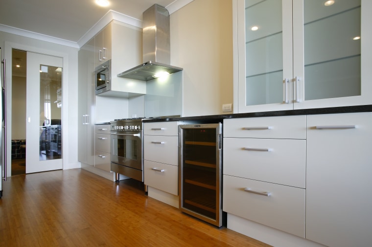 A view of the kitchen featuring solid bamboo cabinetry, countertop, cuisine classique, floor, flooring, hardwood, interior design, kitchen, room, wood flooring, gray