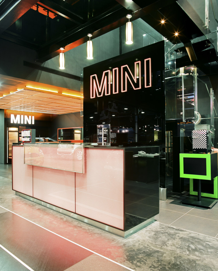 The LED-lit exterior frames are synchronised with the glass, interior design, retail, black