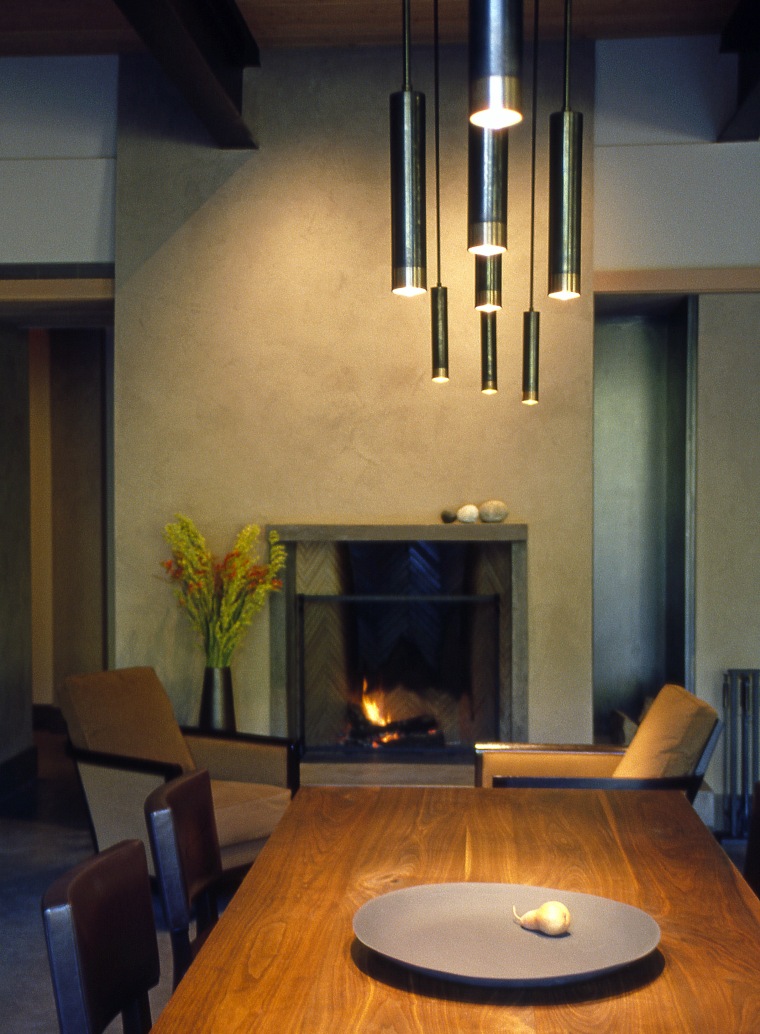 Image of the lounge, dining and kitchen. All ceiling, fireplace, hearth, home, interior design, light fixture, lighting, living room, room, table, wall, black, brown