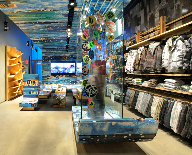 View of the clothing displays including curved panels retail, black