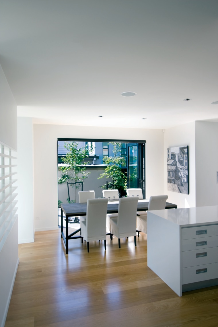 View of a kitchen and dining area designed architecture, ceiling, daylighting, floor, furniture, house, interior design, living room, table, gray