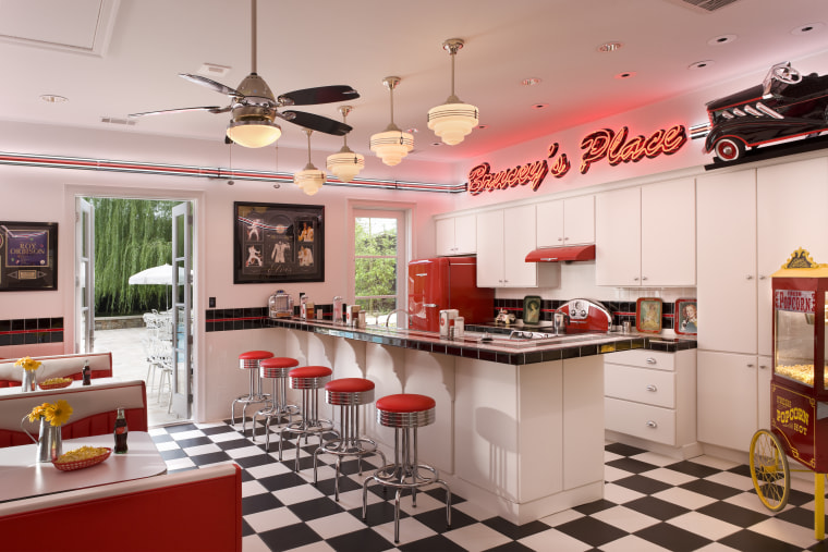 View of retro-styled kitchen featuring black and white countertop, interior design, kitchen, real estate, gray, red