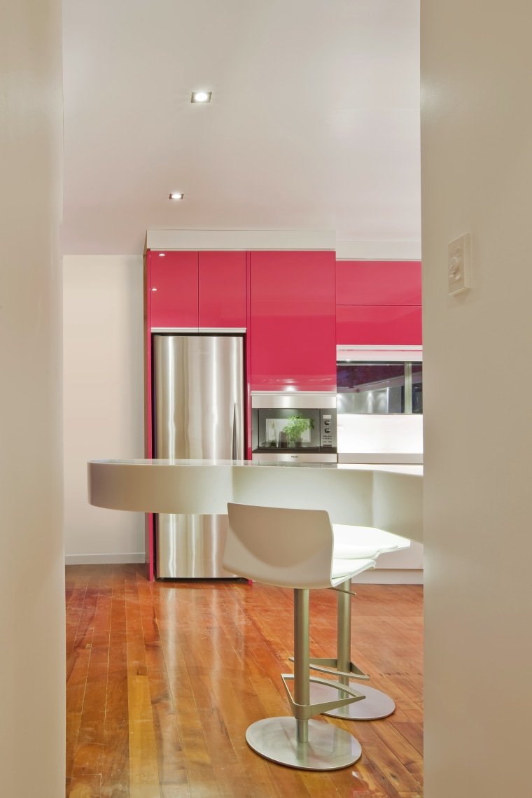View of a kitchen which features pink coloured ceiling, floor, flooring, furniture, hardwood, interior design, kitchen, laminate flooring, living room, product design, shelf, shelving, table, wall, wood flooring, gray, orange
