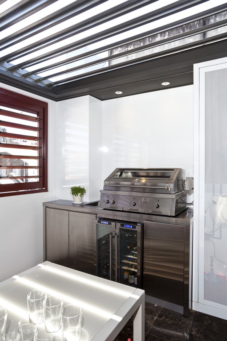 View of an outdoor kitchen which features a home appliance, interior design, kitchen, major appliance, white