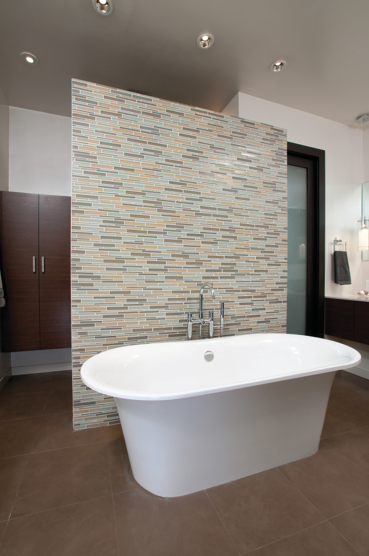 A Victoria & Albert bathtub is the centerpiece architecture, bathroom, floor, flooring, home, interior design, plumbing fixture, room, sink, tap, tile, wall, gray