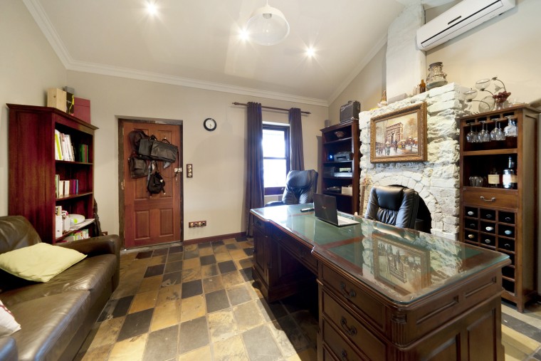 This renovated cottage has become a home office. countertop, estate, home, interior design, kitchen, property, real estate, room, gray, brown