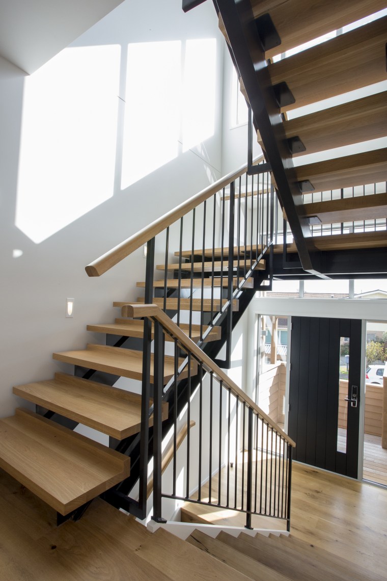 Riderless steel stairs with blond wood treads and baluster, daylighting, floor, handrail, home, house, interior design, stairs, structure, wood, brown, gray