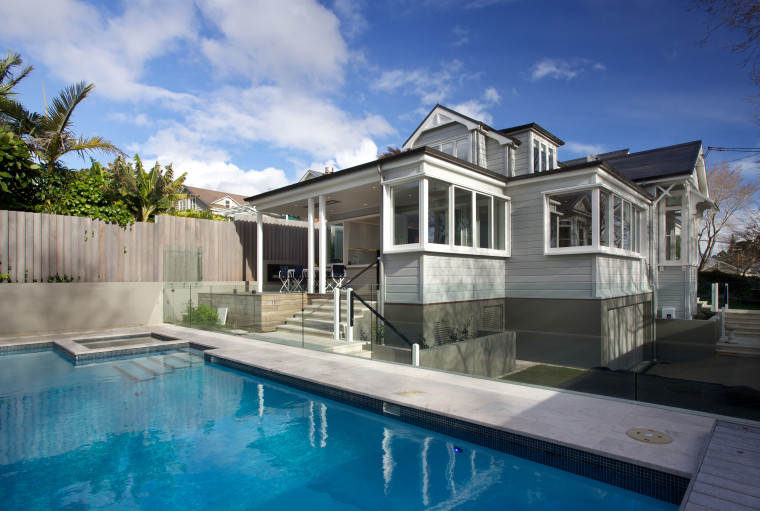 A major renovation by Scarlet Architects has transformed architecture, backyard, cottage, estate, facade, home, house, property, real estate, residential area, swimming pool, villa, teal, gray