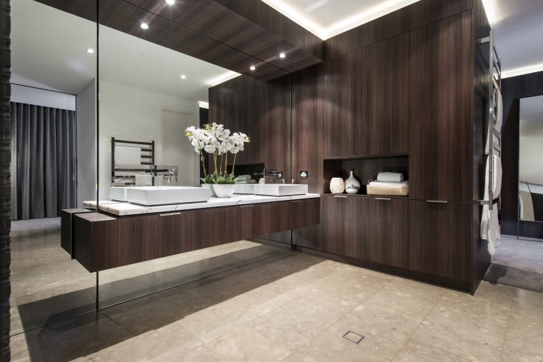 With the mirror wall above and below, this cabinetry, countertop, floor, flooring, interior design, kitchen, room, black, gray