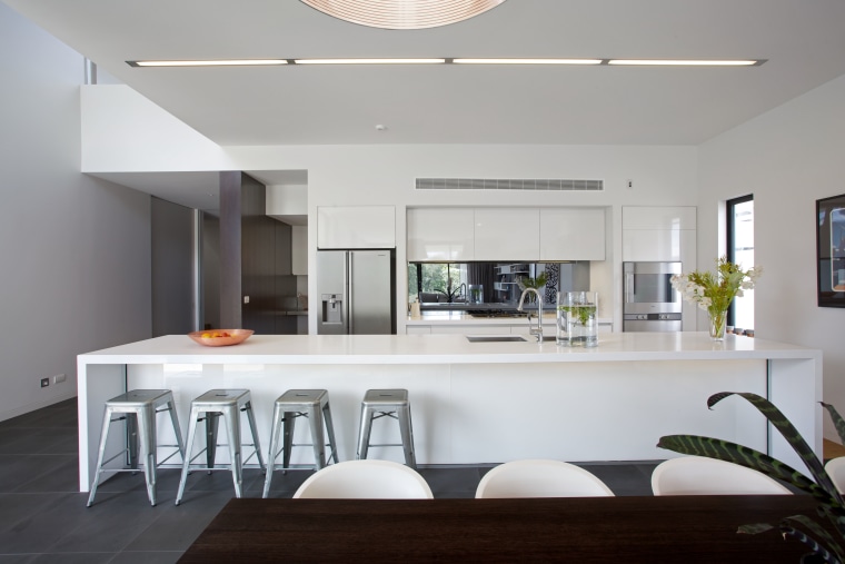 A 5m-long island with a Caesarstone top and architecture, countertop, house, interior design, kitchen, real estate, table, gray