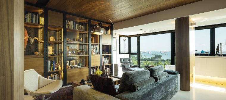 The interior of this renovated 1970s apartment features interior design, living room, real estate, window, brown