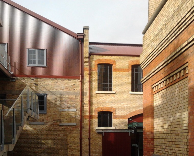 Historic buildings have a value to the community apartment, architecture, brick, brickwork, building, facade, home, house, neighbourhood, property, real estate, residential area, roof, siding, wall, window, brown