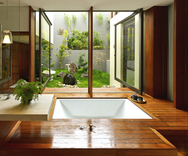 Pivoting windows over this tub open out to architecture, floor, home, house, interior design, window, wood, brown, white