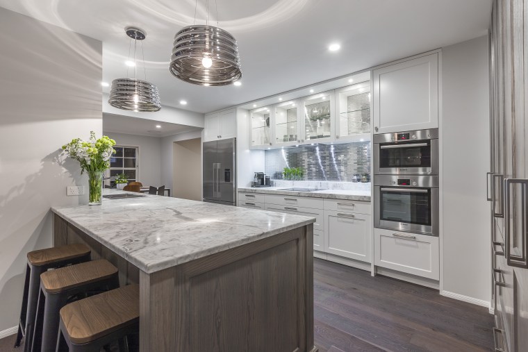This eclectic, finely balanced aesthetic is by designer cabinetry, countertop, cuisine classique, interior design, kitchen, real estate, gray