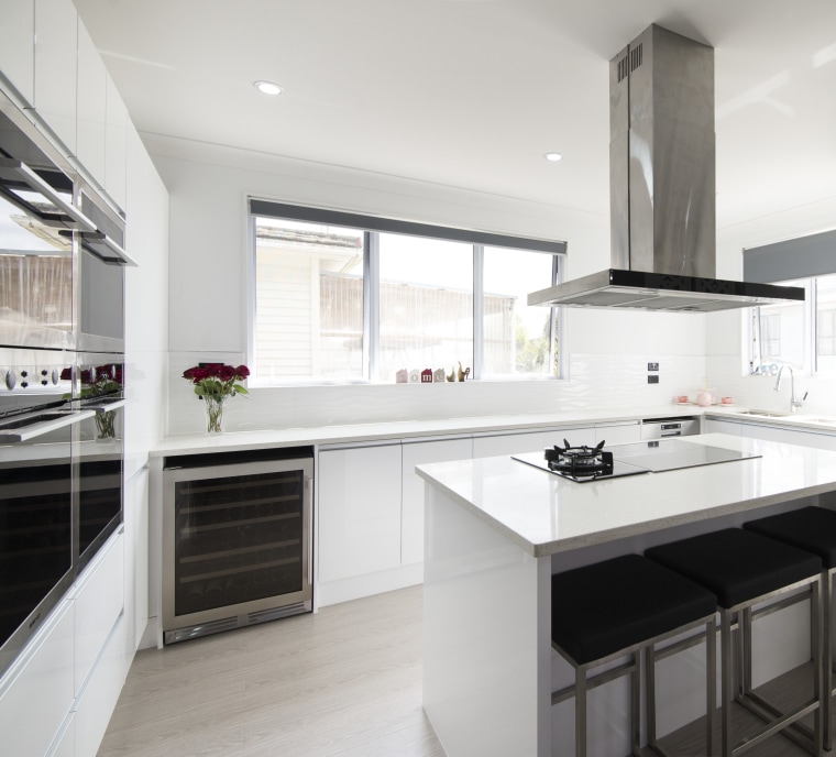 The attractive and highly functional ovens, cooktops, rangehood, cabinetry, countertop, cuisine classique, interior design, kitchen, real estate, room, white