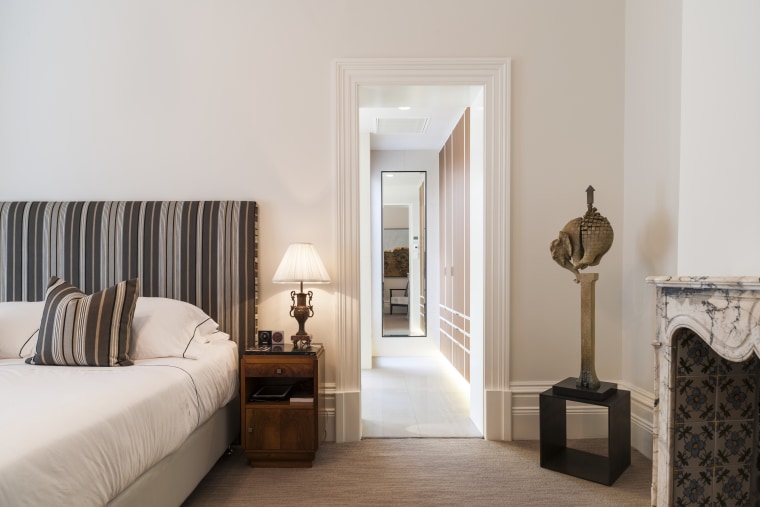 The long view this ensuite by designers bed, bed frame, bedroom, estate, floor, flooring, furniture, home, interior design, property, real estate, room, suite, wall, wood, gray