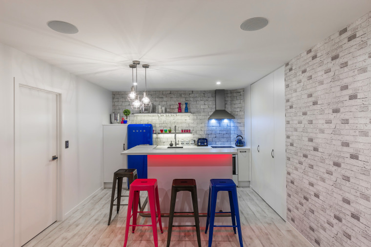 Keeping the cabinetry low added to the feeling apartment, architecture, ceiling, home, house, interior design, property, real estate, room, table, gray