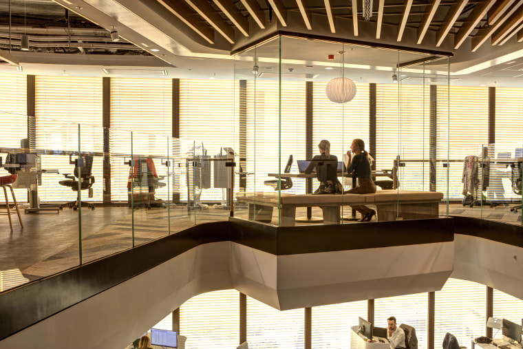 The slatted wood ceiling on the top floor interior design, brown