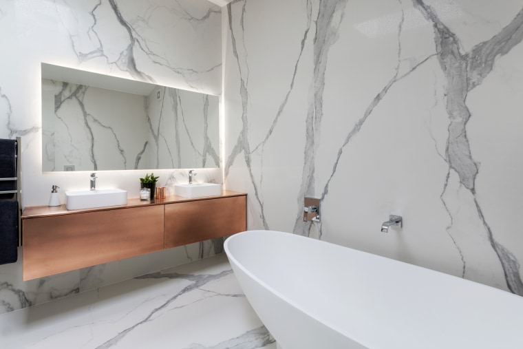 The upmarket aesthetic in this bathroom is achieved architecture, bathroom, floor, home, interior design, product design, room, tap, tile, wall, gray