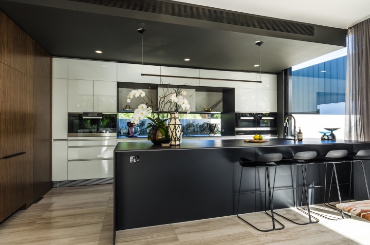 Rear wall cabinetry in white glass with a cabinetry, countertop, cuisine classique, interior design, kitchen, black, gray