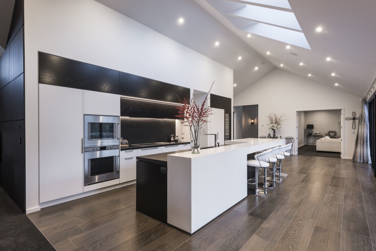 A stepped countertop helps evoke the spatial features countertop, floor, flooring, interior design, kitchen, gray