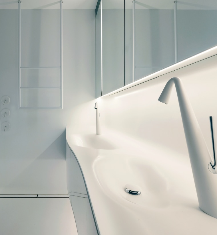 For this bathroom, the space-age vanity includes twin architecture, bathroom, bathtub, design, floor, flooring, interior design, line, material property, plumbing fixture, room, sink, tap, tile, white, gray, white