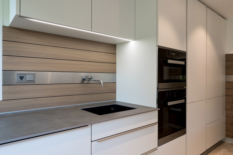 Understated satin lacquer cabinetry helps to blend this architecture, building, cabinetry, ceiling, countertop, cupboard, drawer, floor, furniture, home, home appliance, house, interior design, kitchen, material property, plywood, property, real estate, room, gray