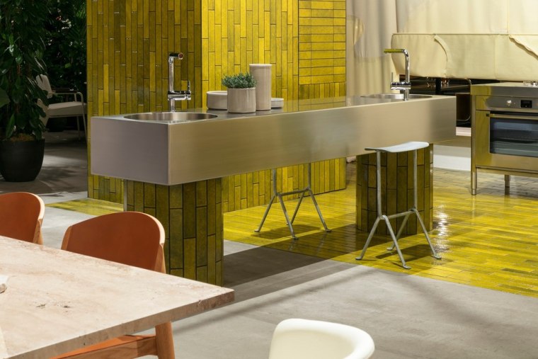 The kitchen was the starting point for their architecture, bar stool, building, chair, countertop, design, floor, flooring, furniture, house, interior design, material property, property, restaurant, room, table, yellow, brown, gray