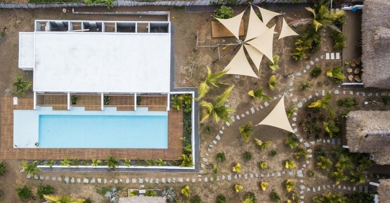 Each of the four rooms features its own architecture, building, facade, home, house, landscape, plant, property, real estate, residential area, roof, room, urban design, wall, window, brown
