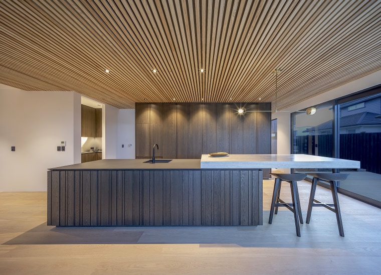 Picking up on the clean lines of the architecture, building, ceiling, design, floor, flooring, furniture, home, house, interior design, lighting, lobby, material property, property, real estate, room, table, wall, gray