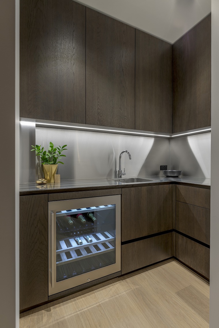 Room at the back – the dramatic, clean-lined building, cabinetry, countertop, cupboard, floor, flooring, furniture, gloss, interior design, kitchen, kitchen stove, material property, property, room, shelf, tile, black, gray