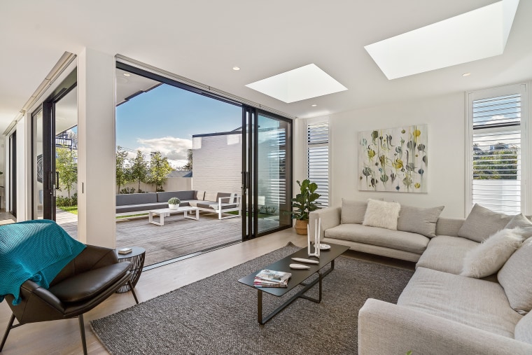 Consider incorporating skylights in various rooms of apartment, architecture, building, ceiling, coffee table, daylighting, estate, floor, furniture, home, house, interior design, living room, property, real estate, room, table, window, gray